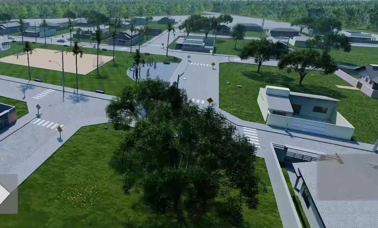 Perspectiva do bairro com campo de areia, praças arborizadas e casas